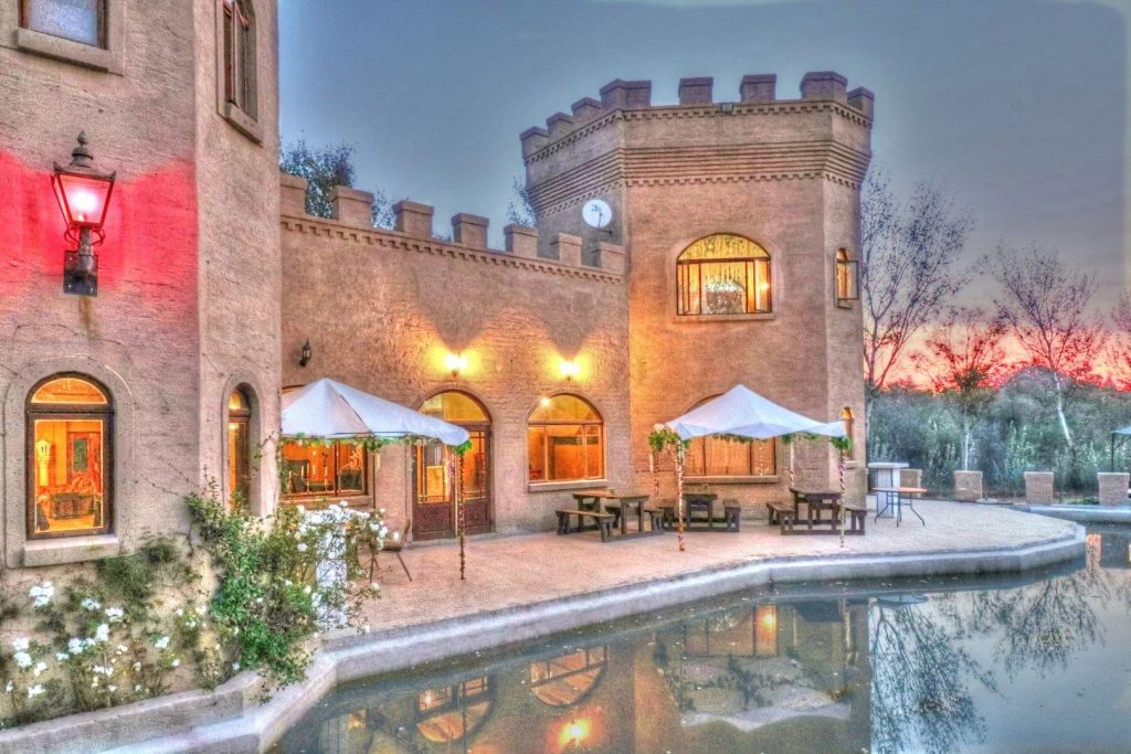 Rietfontein’s Mirrored Fortress: A Gothic Dream Amongst Emerald Hills