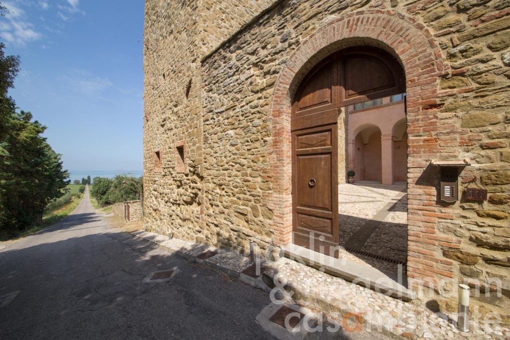 Whispers of the 13th Century: A Castle Apartment by Lake Trasimeno’s Shores