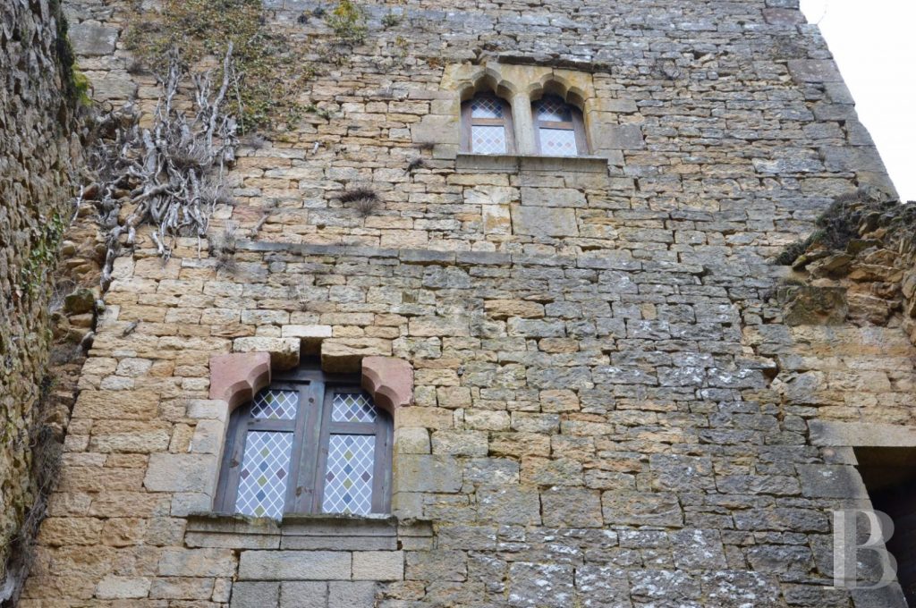 Whispers of Ain: A Castle’s Timeless Vigil Over the River’s Song