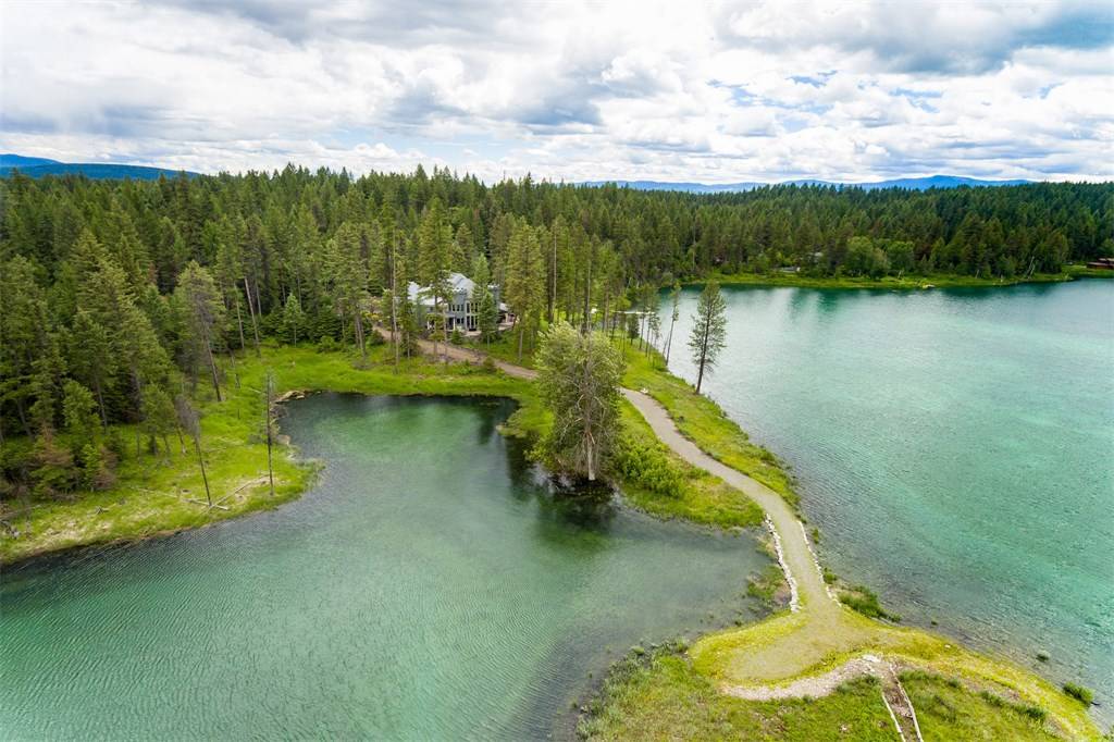 Whispers of the Swan: A Lakeside Castle in Montana’s Wild Embrace